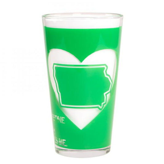 A green dishwasher-safe pint glass featuring a white heart shape containing a green outline of the state of Iowa.