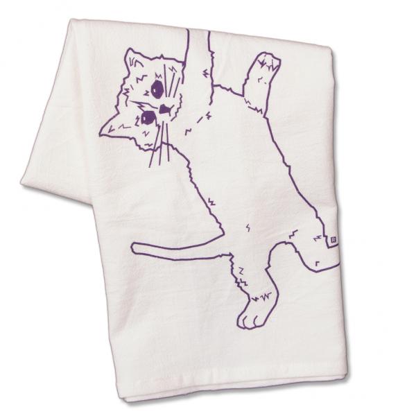 White flour sack kitchen towel featuring a purple line drawing of a cat hanging by one paw.