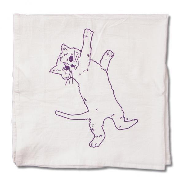 A white flour sack kitchen towel printed with a purple line drawing of a cat lying on its back.