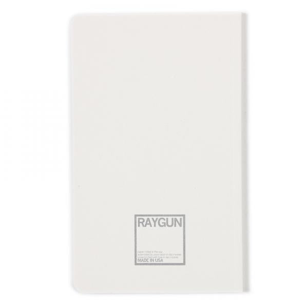 Back cover of a white notebook featuring a gray screen print logo that reads RAYGUN and MADE IN USA.
