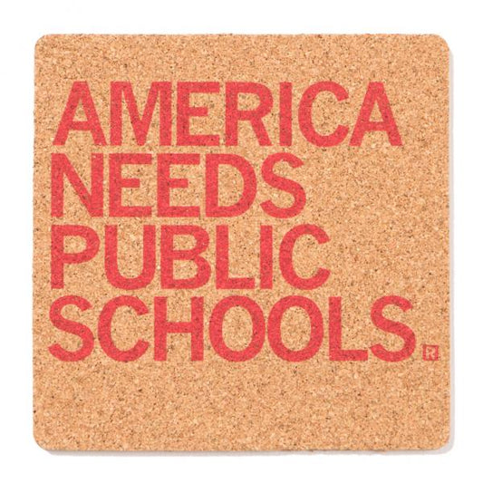 Square cork coaster printed with the red text AMERICA NEEDS PUBLIC SCHOOLS.