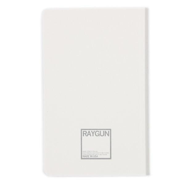 White notebook with a screen printed square logo on the front cover reading RAYGUN and MADE IN USA.