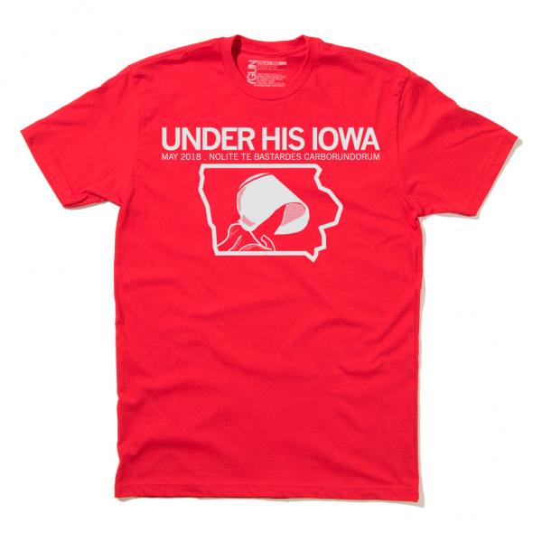 Red union-made t-shirt featuring the text UNDER HIS IOWA, MAY 2018, and NOLITE TE BASTARDES CARBORUNDORUM with a white outline of the state of Iowa containing a stylized bonnet icon, part of a retired Iowa Abortion Access Fund design.