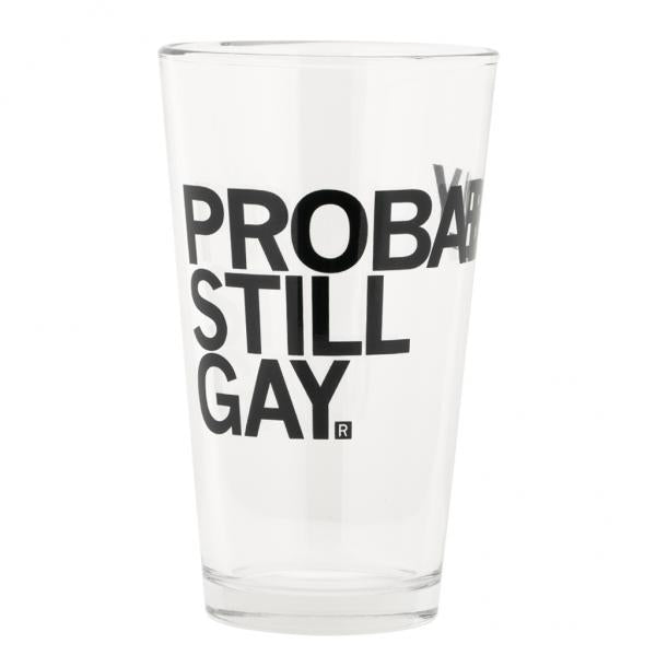 A dishwasher safe pint glass printed with the black text PROBABLY STILL GAY.