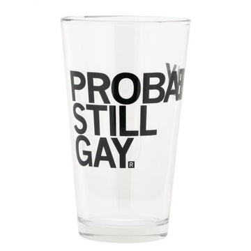 A dishwasher safe pint glass printed with the black text PROBABLY STILL GAY.