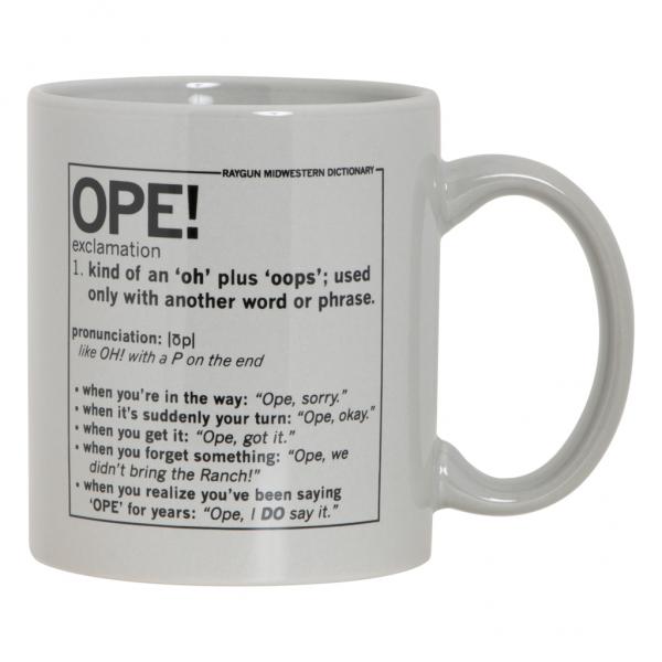A light gray RAYGUN mug featuring a dictionary-style definition of the Midwestern exclamation OPE! and several examples of its usage.