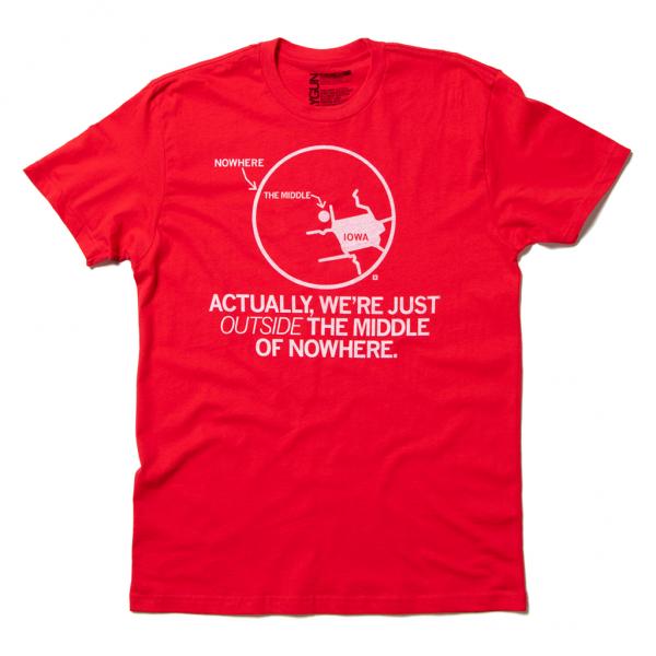 Red Iowa t-shirt featuring a diagram of a circle labeled The Middle with a stick figure pointing to Nowhere outside the circle, accompanied by the text Actually, were just outside the middle of nowhere on this retired design.