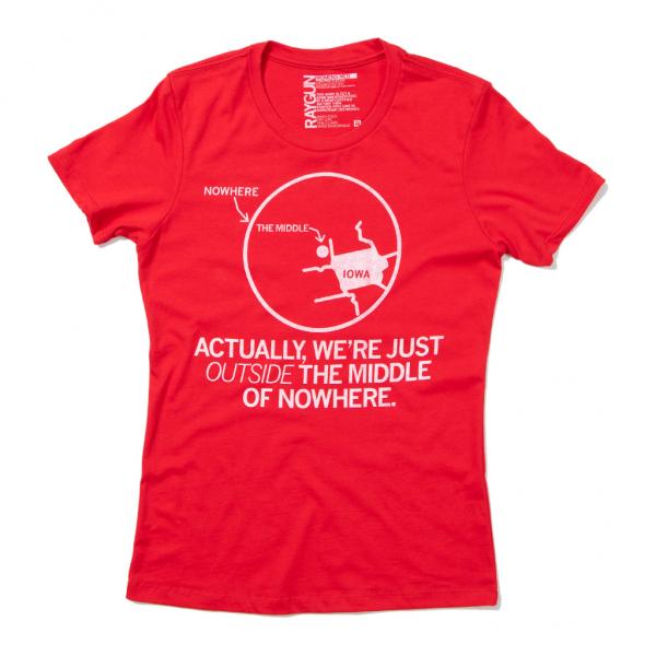 Union-made red short-sleeved t-shirt featuring a white graphic of an Iowa map inside a circle, captioned Nowhere, The Middle, with the text: Actually, we’re just outside the middle of nowhere.