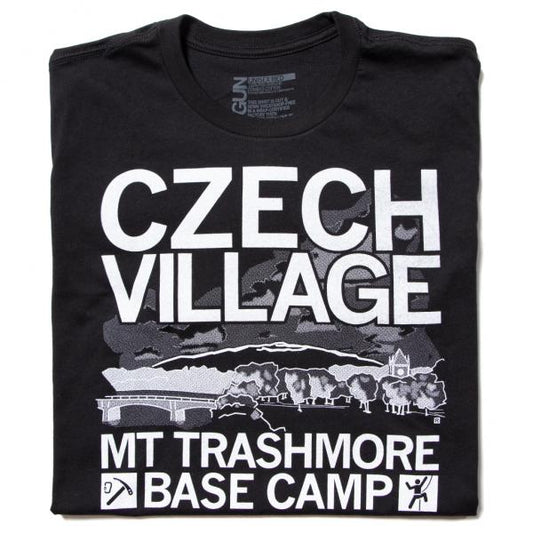 Black Czech Village Mount Trashmore t-shirt featuring a landscape graphic with a bridge and buildings, accompanied by the text MT TRASHMORE BASE CAMP and rock climbing icons.
