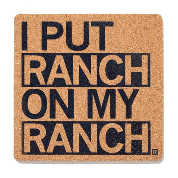 Square natural cork coaster with the text I PUT RANCH ON MY RANCH printed in bold black letters.