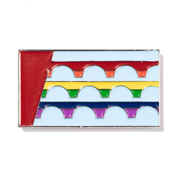 Rectangular RAYGUN enamel pin featuring a red vertical stripe on the left and three horizontal rows of rainbow-colored arches against a light blue background.