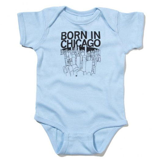 Light blue baby rib cotton onesie featuring a black graphic of the Chicago skyline and the text BORN IN CHICAGO.