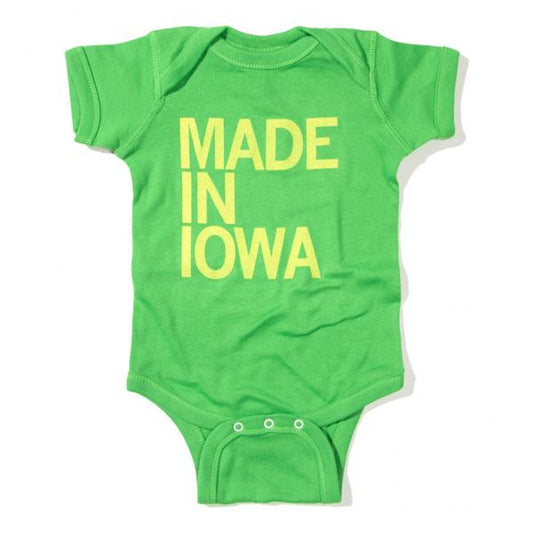 Bright green Apple Onesie with the yellow text MADE IN IOWA printed on the chest.