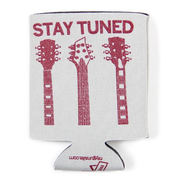 White scuba foam cooler printed with the words STAY TUNED above three guitar headstocks in maroon plastisol ink.