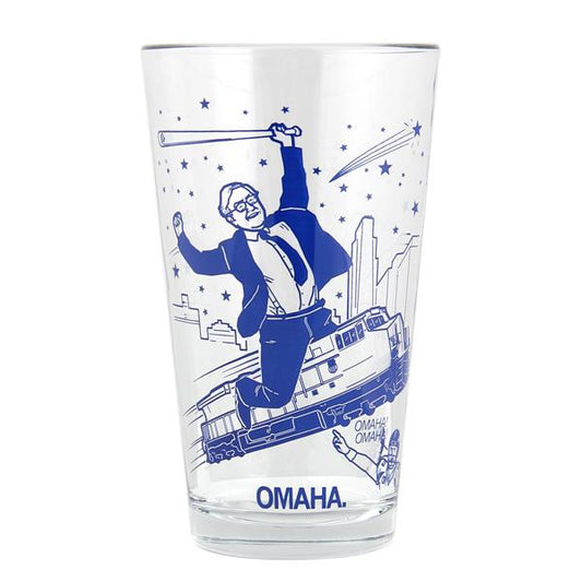 A clear pint glass with a blue Omaha Mashup graphic of a man in a suit holding a baseball bat above a train, with the word OMAHA printed at the base.