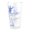 Clear dishwasher-safe pint glass featuring a blue line drawing of a person in a top hat riding a dinosaur and a fighter plane, with the word FREEDOM printed at the bottom.