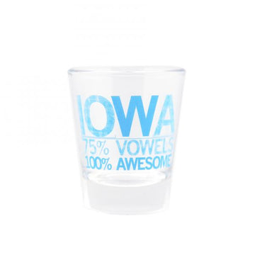 Clear dishwasher-safe shot glass with blue text that reads IOWA, 75% VOWELS, 100% AWESOME.