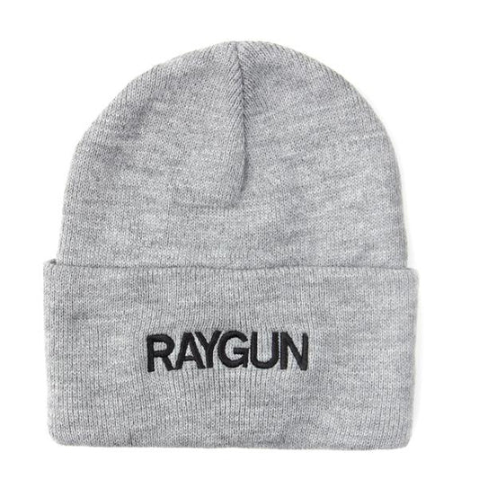 Light gray knit beanie with RAYGUN embroidered in black on the cuff of this made in USA stocking cap.