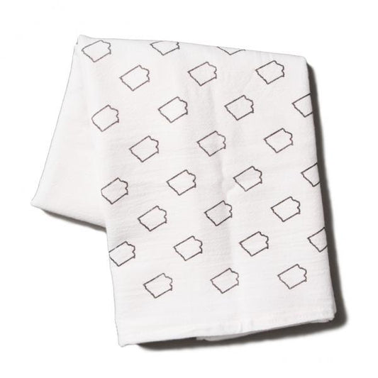 White flour sack kitchen towel folded with a repeating dark gray outline pattern of the state of Iowa.
