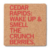 Square cork coaster featuring red text that reads, CEDAR RAPIDS: WAKE UP & SMELL THE CRUNCH BERRIES.