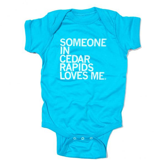 Bright blue baby rib cotton infant onesie with the text SOMEONE IN CEDAR RAPIDS LOVES ME printed in white.