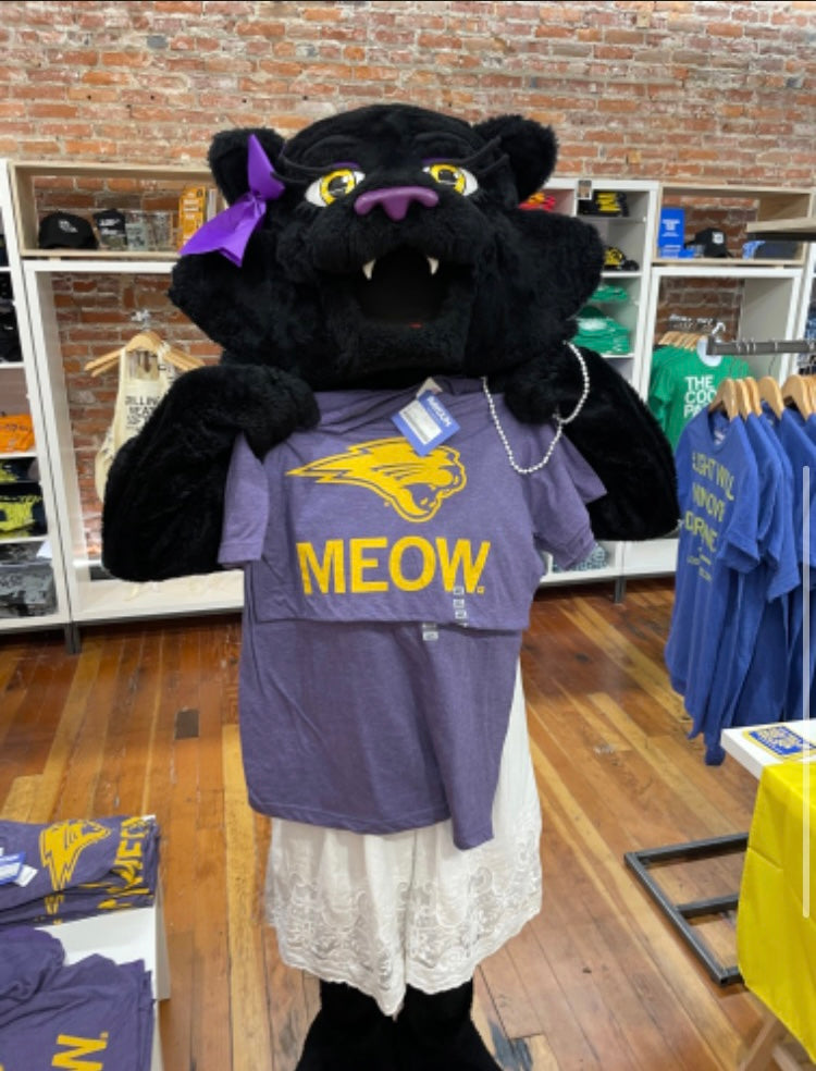 A black panther mascot with a purple hair bow holds up a union made purple Panthers t-shirt featuring a panther logo and the word MEOW in gold lettering.