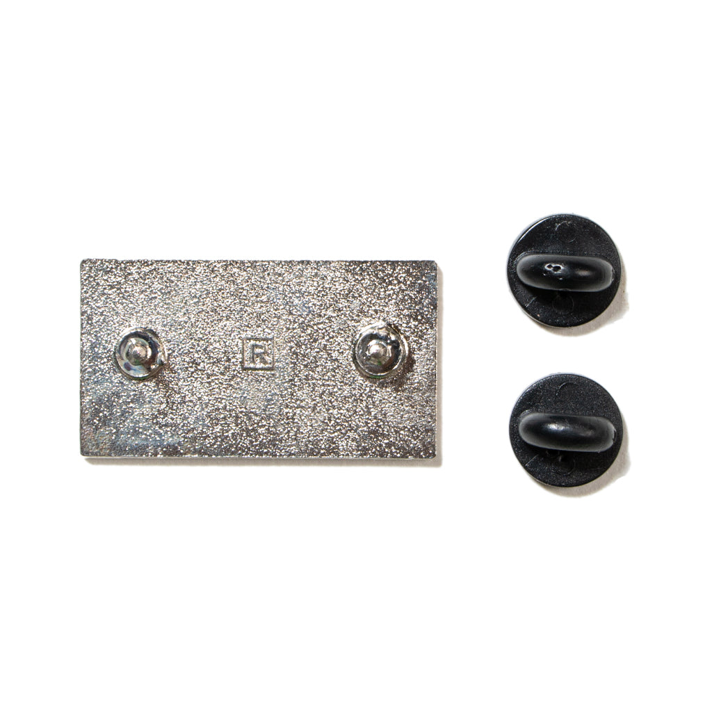 Rectangular America Needs Librarians enamel pin back with two posts and two black rubber clutches.