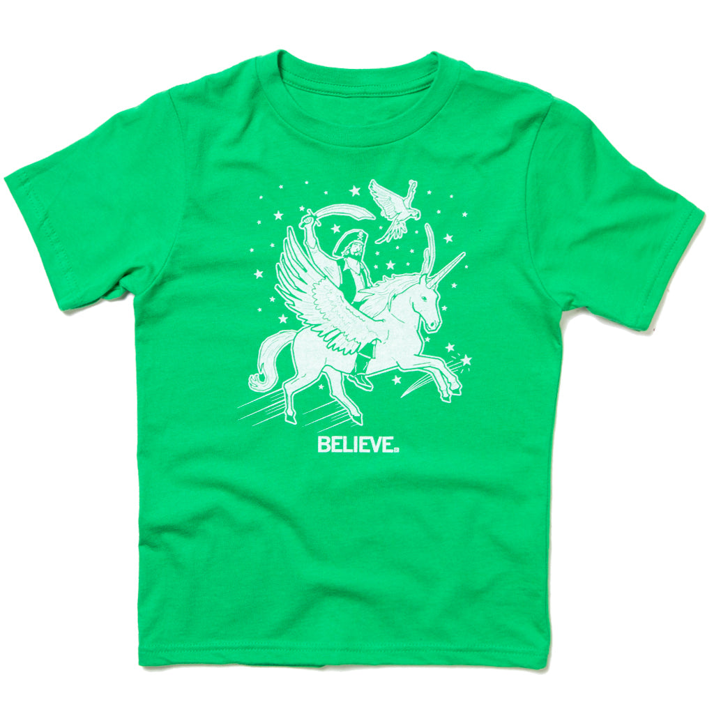 Kelly green combed ringspun cotton t-shirt with a white graphic of a pirate riding a winged unicorn with a bird above, and the word BELIEVE. below.