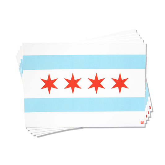 A stack of Chicago flag vinyl stickers, each featuring two horizontal light blue stripes and four red stars on a white background.