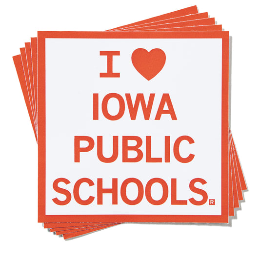 A stack of RAYGUN square vinyl stickers with red text and a heart icon that reads, I heart Iowa Public Schools.