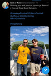 Two men stand on a boat on a lake; one wears an Iowa City yellow t-shirt, and the other wears a blue t-shirt that says Ann Arbor is actually a pretty nice lady once you get to know her, both shirts being union made.