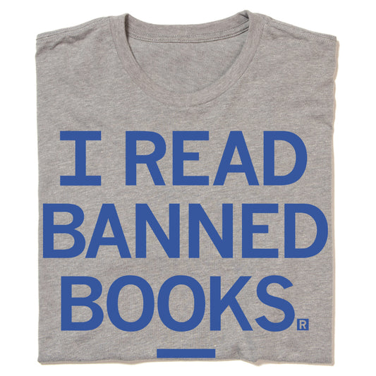 A folded heather grey t-shirt with royal blue in that says, "I Read Banned Books" in all caps.