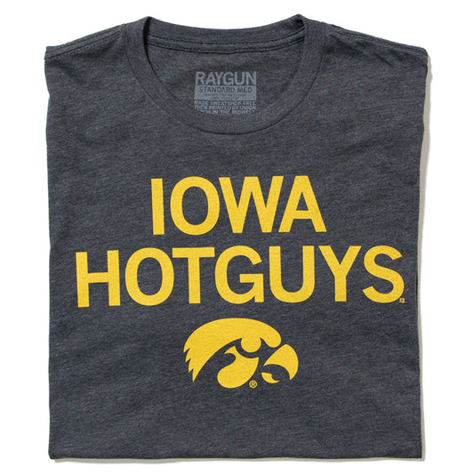 A folded heather black t-shirt with centered golden yellow text that says, "IOWA HOTGUYS" over the University of Iowa Tigerhawk logo.