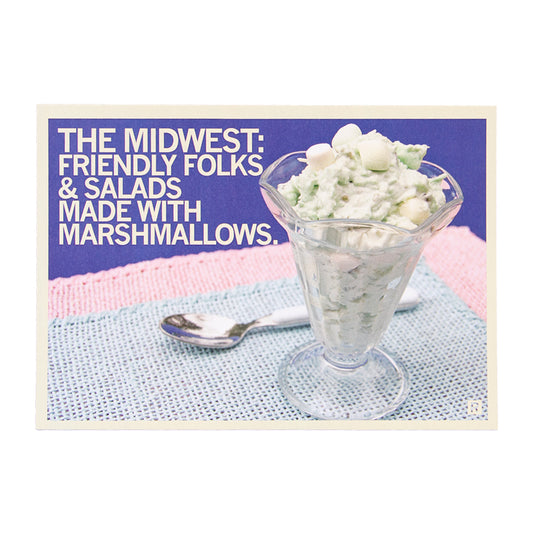 A glass dish filled with green marshmallow salad next to a spoon, from a Midwest postcard with text reading, The Midwest: Friendly folks & salads made with marshmallows.