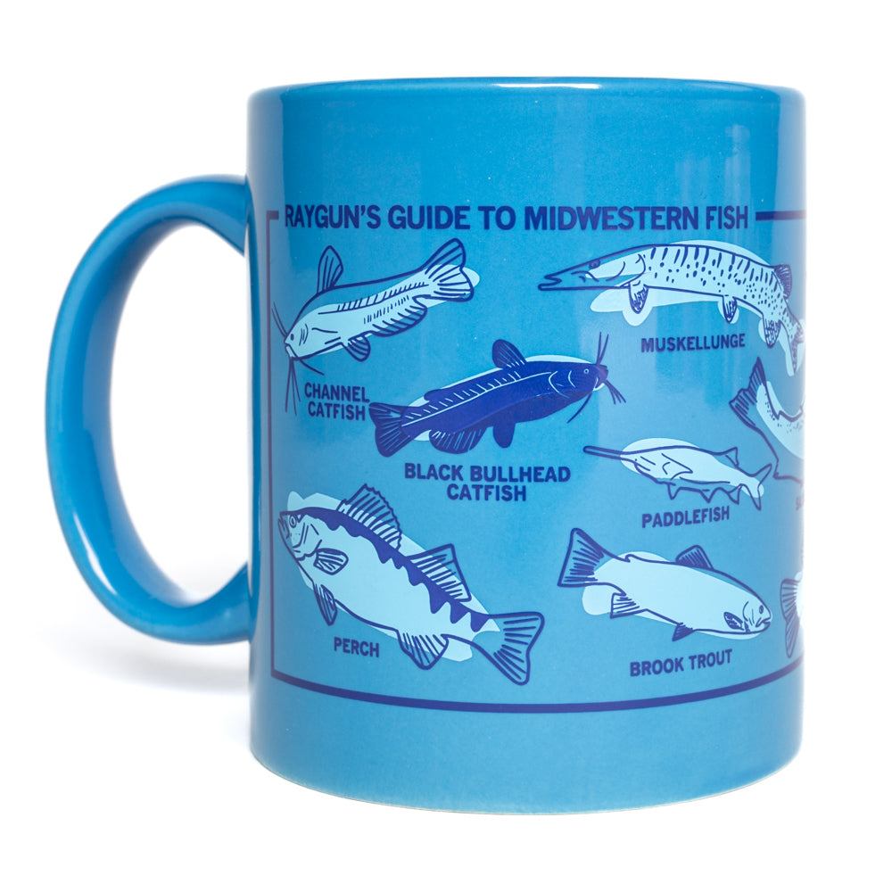 Hawaiian blue RAYGUN mug illustrated with a guide to Midwestern fish, including labeled drawings of a channel catfish, black bullhead catfish, muskellunge, paddlefish, perch, and brook trout.