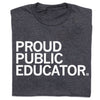 A folded charcoal t-shirt with white text that reads "Proud Public Educator"