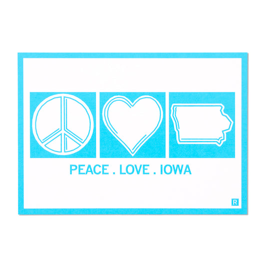 A bright blue Peace Love Iowa graphic featuring a white peace sign, heart, and state outline, with the text PEACE . LOVE . IOWA printed below.