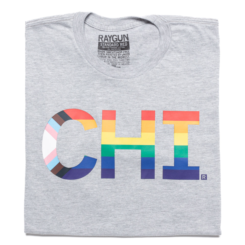 Gray union-made t-shirt featuring CHI printed in a rainbow and progress pride flag pattern for Chicago Pride.