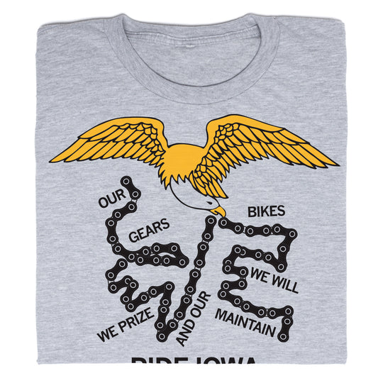 Grey RAYGUN t-shirt featuring a graphic of an eagle with a bicycle chain and the text: OUR GEARS BIKES WE WILL WE PRIZE AND OUR MAINTAIN.
