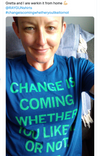 A person wearing a union made blue t-shirt with the text CHANGE IS COMING WHETHER YOU LIKE OR NOT printed in green.
