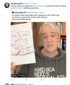 Scott Simon holds up a copy of Open Book while wearing a gray shirt that says America Needs Journalists.