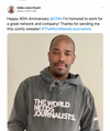 Dallas Lewis-Bryant wearing a union-made grey pullover hoodie with the text THE WORLD NEEDS JOURNALISTS.