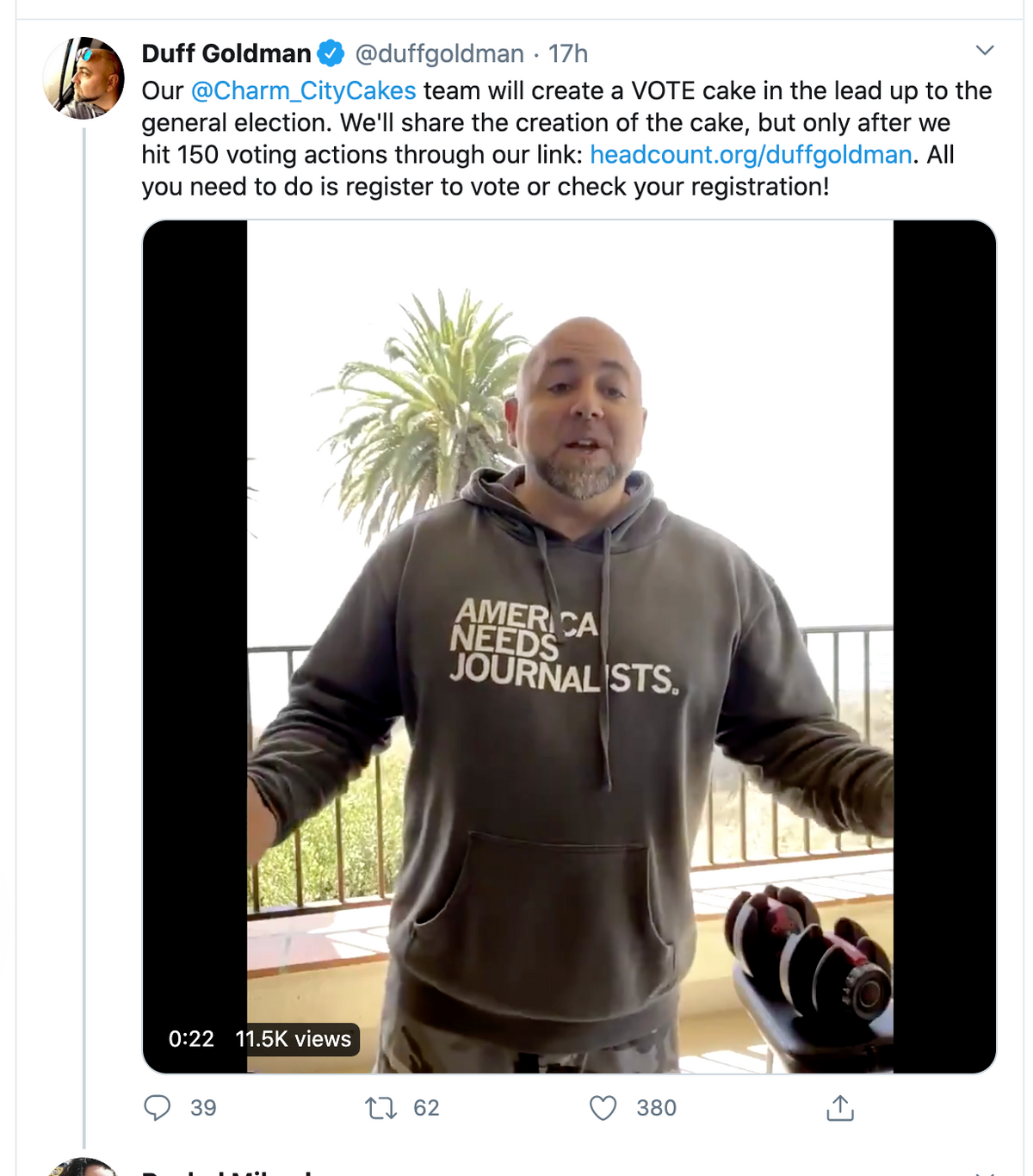 Duff Goldman stands on a balcony wearing a Pigment Black Pullover Hoodie that says AMERICA NEEDS JOURNALISTS in a video post about voter registration.