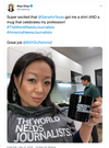 A woman in a union made grey t-shirt that says THE WORLD NEEDS JOURNALISTS holds a black mug that reads AMERICA NEEDS JOURNALISTS.