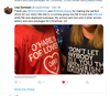 Two people wear black and red RAYGUN t-shirts featuring white text that references O’Hare International Airport and romance.
