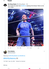 CM Punk stands in a professional wrestling ring wearing a blue union labor T-shirt that says Get your own then tell it what to do.