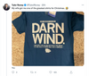 A cool blue Midwest T-shirt featuring a map of the United States and the text: The Midwest is like: Darn wind. Wouldn’t be so bad without the wind. It’d be nice if there was just a breeze.