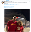 A man and woman wearing sweatshop-free, red Kansas City Chiefs jerseys stand in front of Empower Field at night.