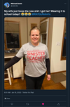 A woman wears a heather grey t-shirt that says Just another sinister teacher over a black long-sleeved shirt.