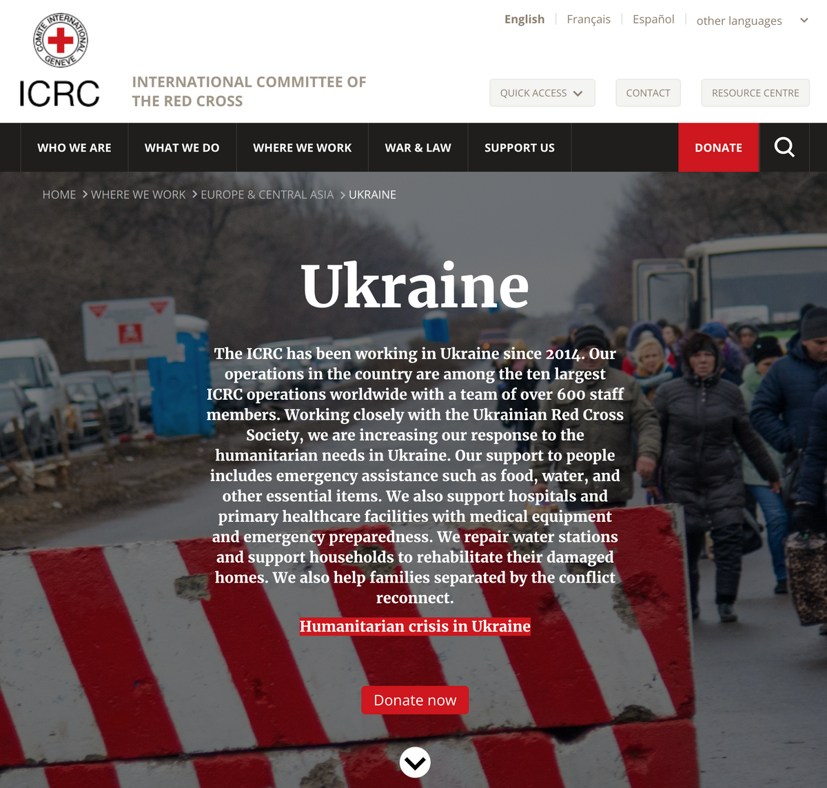 ICRC website header featuring the title Ukraine, a description of United Help Ukraine humanitarian operations, a Donate now button, and a background image of people standing behind a red and white barrier.